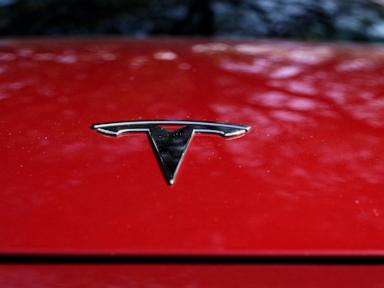 Tesla’s Stock Dips as Earnings Fall Short, EV Manufacturer Signals Slower Growth in 2024